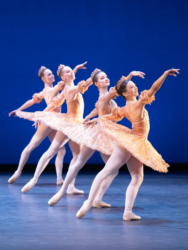 Four English National Ballet Dancers dressed in peach tutus in Goerge Balanchine's Theme and Variations.
