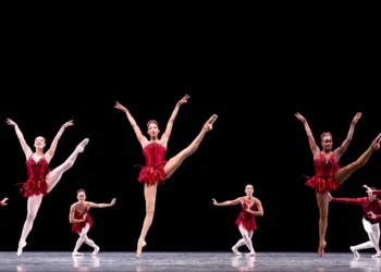 Pacific Northwest Ballet Jewels Review featuring Amanda Morgan westing a ruby red short dress.