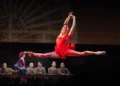 Philadelphia Ballet Carmen and Boléro Review 2025 featuring Mayara Piñeiro as the title character in a split leap wearing a red dress.