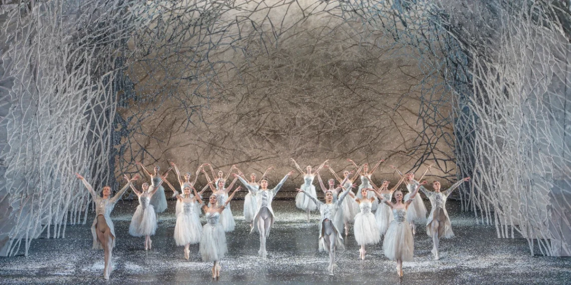 Birmingham Royal Ballet The Nutcracker Review 2025 featuring dancers in white romantic tutus and tunics in the snow scene.