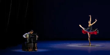Dutch National Ballet Program A Review 2025 in NYC featuring Vincent Van Amsterdam on the accordion accompanying Lore Zonderman in a black, white and red dress.