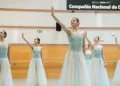 An Interview with Dancers of the Spanish National Dance Company featuring the company in long light blue romantic tutus with one arm raised up to the sky.