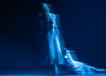 English National Ballet Giselle Review 2026 featuring Emily Suzuki as Giselle and Emma Hawes as Myrtha blurred in gray dresses.